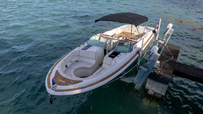 Minsky's Folly II Yacht Photos Pics 2014 Chris-Craft Launch 32 boat docked on calm water.