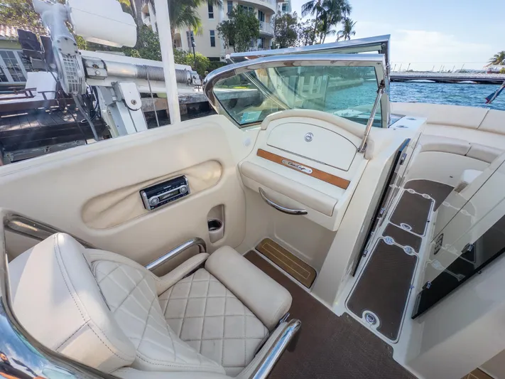 Minsky's Folly II Yacht Photos Pics 2014 Chris-Craft Launch 32 interior with luxurious seating and elegant design.