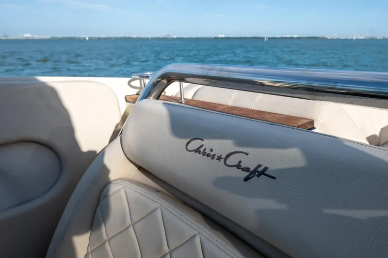 Minsky's Folly II Yacht Photos Pics 2014 Chris-Craft Launch 32 boat interior with logo, ocean view in background.