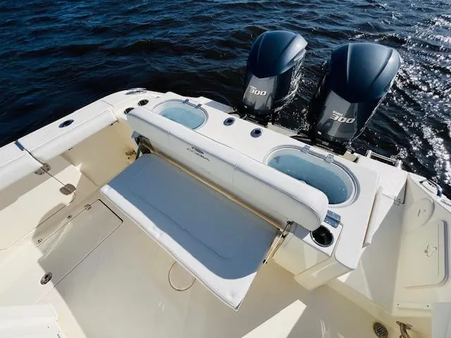  Yacht Photos Pics 2021 Cobia 301 Center Console boat with twin 300 engines on open water.