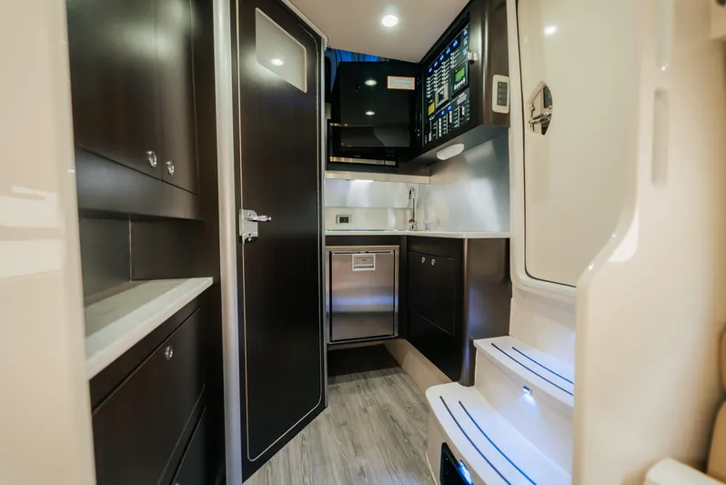 Mmxxi Yacht Photos Pics Interior of 2021 Scout 380 LXF boat, featuring modern kitchen and sleek design.