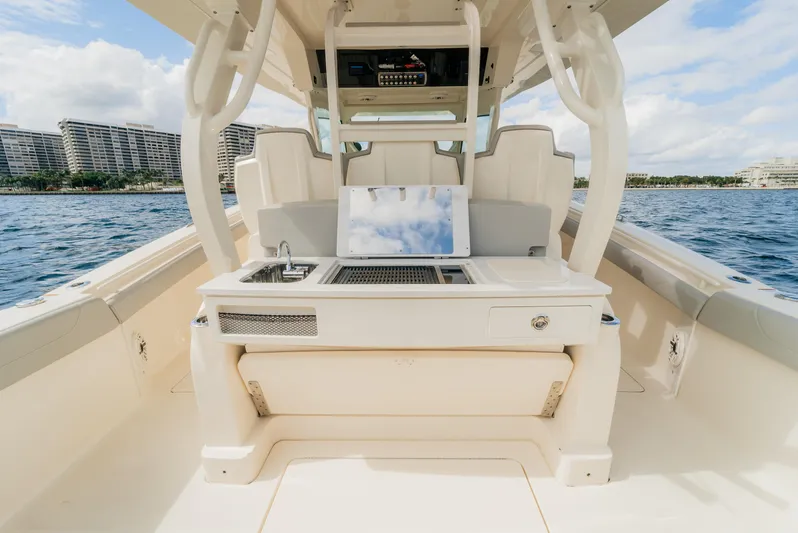 Mmxxi Yacht Photos Pics 2021 Scout 380 LXF boat interior with seating and amenities on the water.
