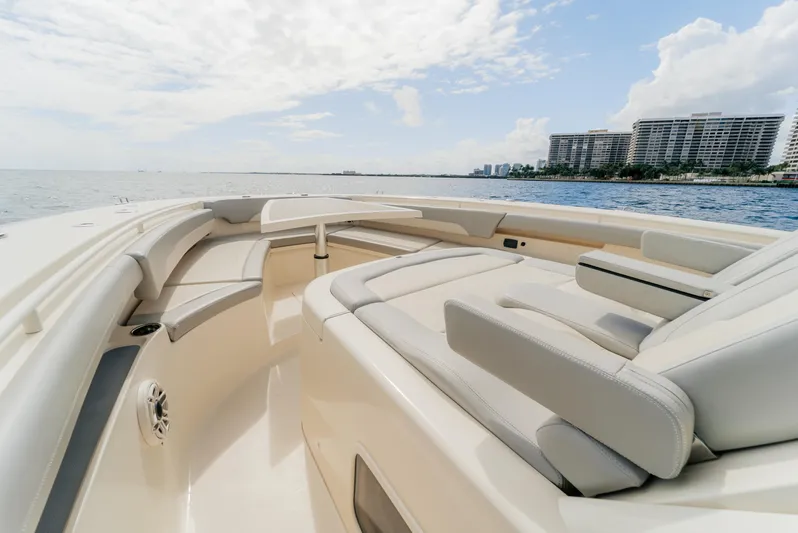 Mmxxi Yacht Photos Pics 2021 Scout 380 LXF boat interior with luxurious seating, ocean view, and modern design.
