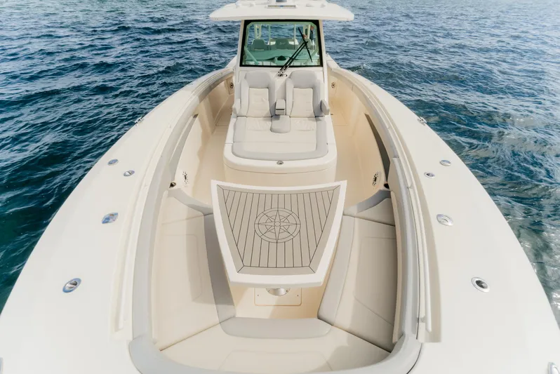Mmxxi Yacht Photos Pics 2021 Scout 380 LXF boat on open water, showcasing luxurious seating and sleek design.