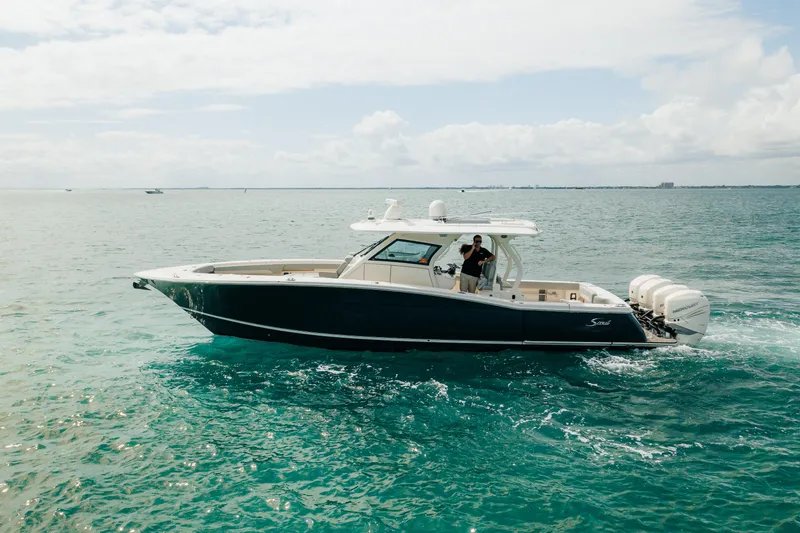 Mmxxi Yacht Photos Pics 2021 Scout 380 LXF boat cruising on open water.