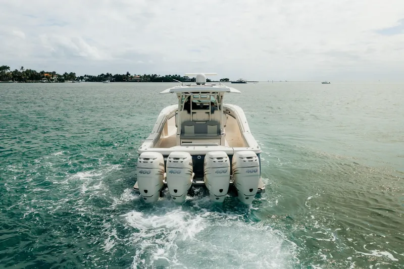 Mmxxi Yacht Photos Pics 2021 Scout 380 LXF boat cruising on open water with four engines.