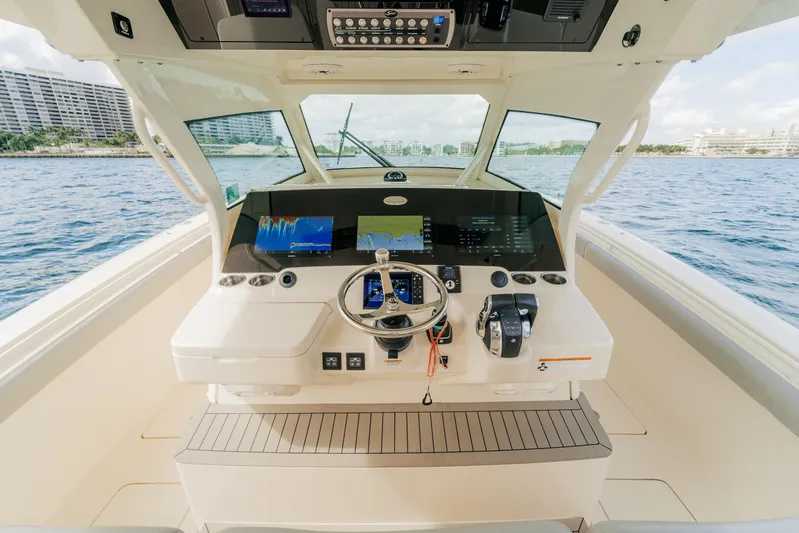 Mmxxi Yacht Photos Pics 2021 Scout 380 LXF boat helm with advanced navigation system on open water.