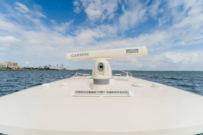 Mmxxi Yacht Photos Pics 2021 Scout 380 LXF boat with Garmin radar on open water under blue sky.