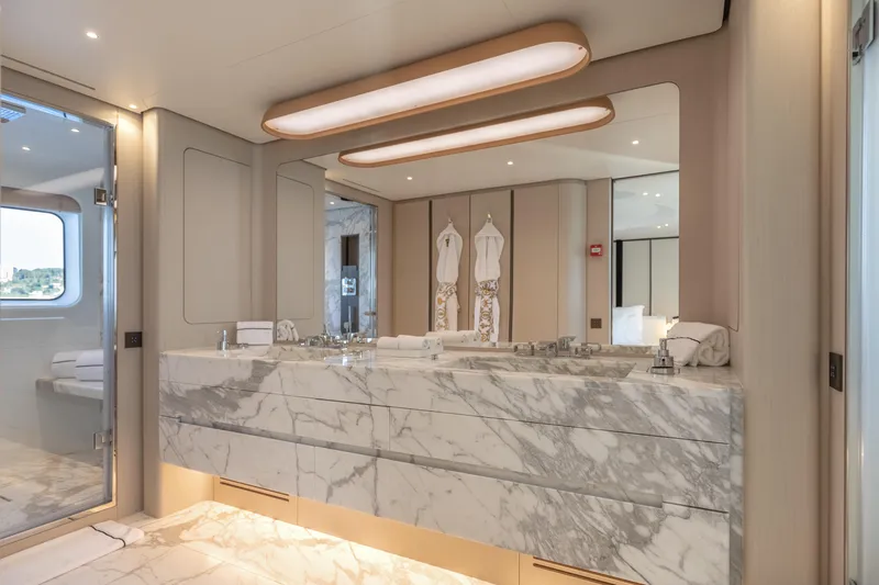 H Yacht Photos Pics Luxurious bathroom in 2023 Azimut Grande 35m yacht with marble countertops and modern lighting.