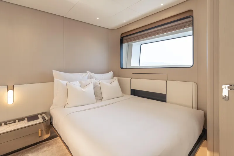 H Yacht Photos Pics Luxurious bedroom interior on 2023 Azimut Grande 35m yacht, featuring modern design and large window.