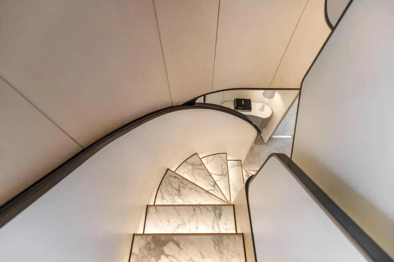 H Yacht Photos Pics Elegant marble staircase on 2023 Azimut Grande 35m yacht, featuring modern design and ambient lighting.