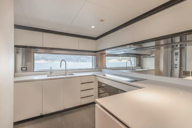 H Yacht Photos Pics Modern kitchen interior on 2023 Azimut Grande 35m yacht, featuring sleek design and large windows.