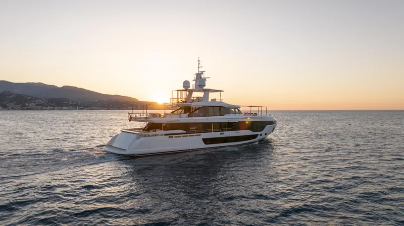 H Yacht Photos Pics 2023 Azimut Grande 35m yacht cruising at sunset on open sea.