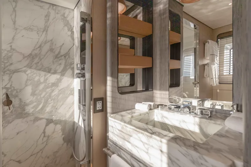 H Yacht Photos Pics Luxurious marble bathroom in 2023 Azimut Grande 35m yacht, featuring modern fixtures and elegant design.