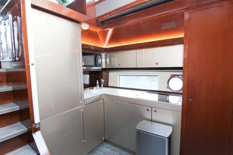 Love Life Yacht Photos Pics Luxurious kitchen interior of 2009 Riva 68' EGO SUPER yacht with modern cabinetry.