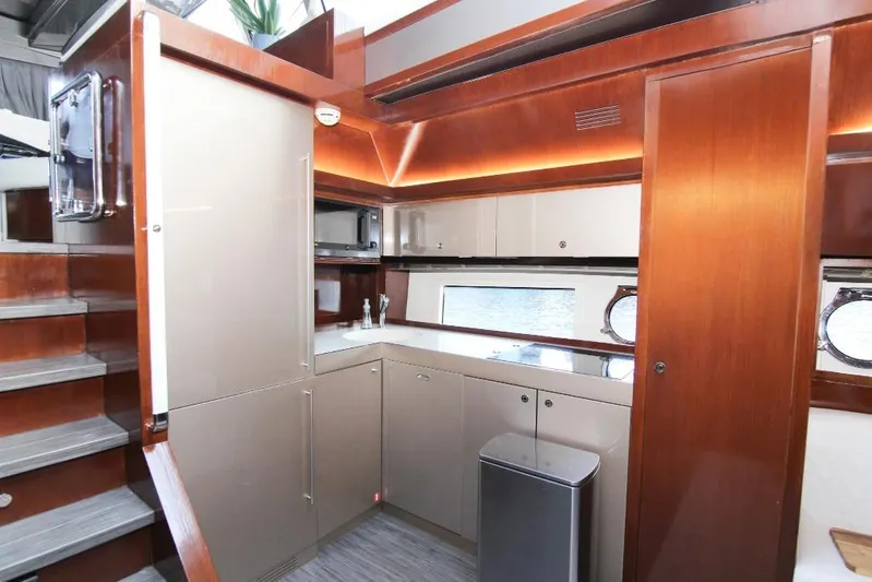 Love Life Yacht Photos Pics Luxurious kitchen interior of 2009 Riva 68' EGO SUPER yacht with modern cabinetry.