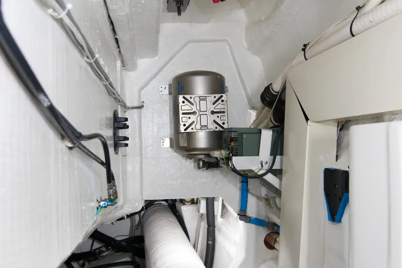 Love Life Yacht Photos Pics Engine room of 2009 Riva 68' EGO SUPER yacht, showcasing mechanical components and wiring.