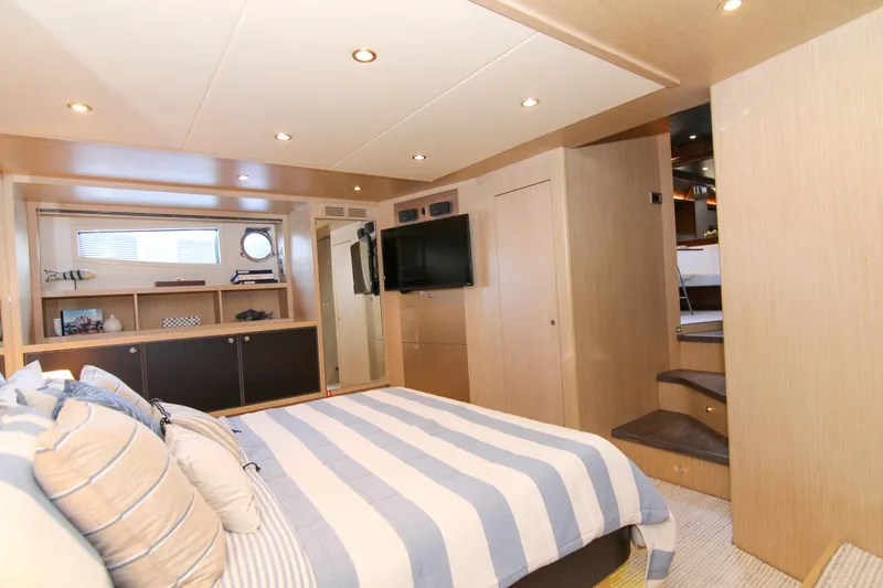 Love Life Yacht Photos Pics Luxurious bedroom interior of 2009 Riva 68' EGO SUPER yacht with striped bedding.