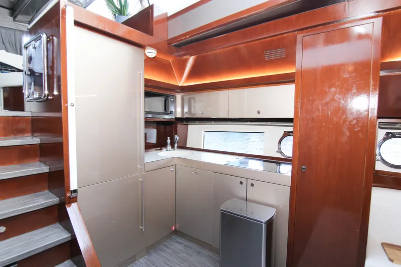 Love Life Yacht Photos Pics Luxurious kitchen interior of 2009 Riva 68' EGO SUPER yacht with modern cabinetry.