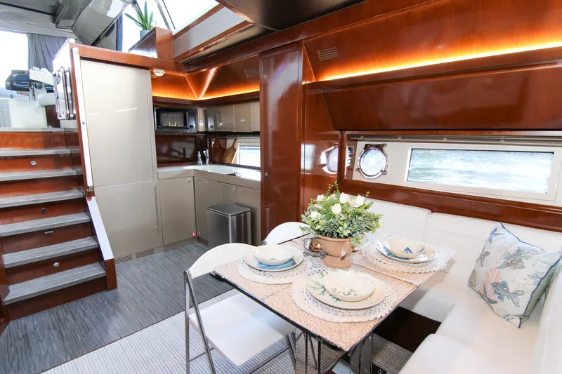 Love Life Yacht Photos Pics Luxurious interior of 2009 Riva 68' EGO SUPER yacht with elegant dining area and modern kitchen.