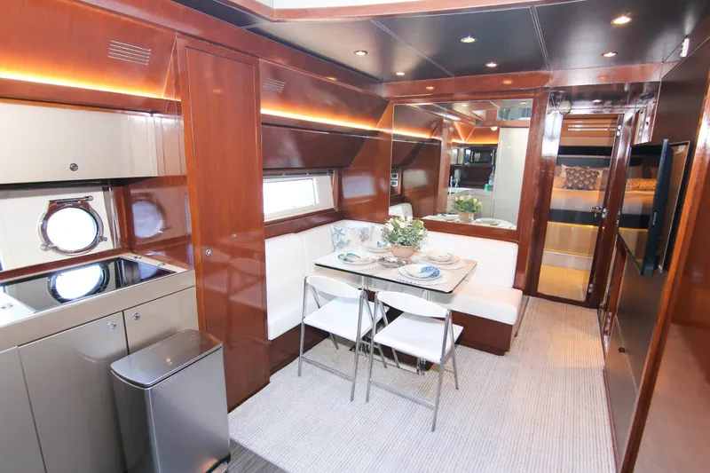 Love Life Yacht Photos Pics Luxurious interior of 2009 Riva 68' EGO SUPER yacht with elegant dining area.