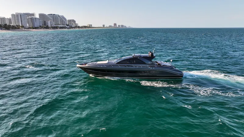 Love Life Yacht Photos Pics Luxury Riva 68' EGO SUPER yacht cruising near city skyline, 2009 model.