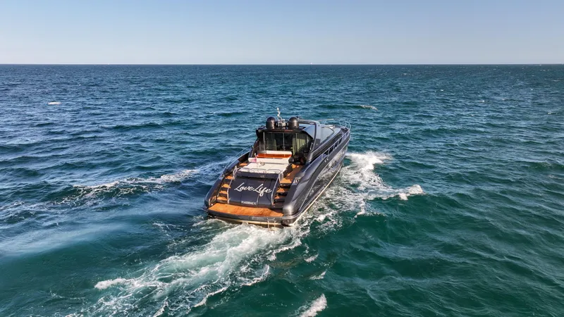 Love Life Yacht Photos Pics Luxurious 2009 Riva 68' EGO SUPER yacht cruising on open sea.