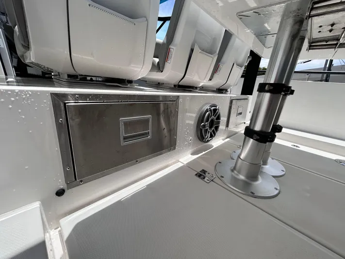  Yacht Photos Pics 2019 Axopar 37 Sun Top boat interior with seating and stainless steel features.
