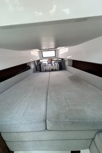  Yacht Photos Pics Interior cabin of 2019 Axopar 37 Sun Top with cozy bedding and window.