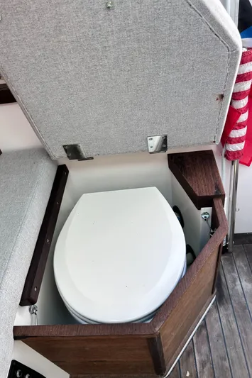  Yacht Photos Pics 2019 Axopar 37 Sun Top boat with hidden toilet under cushioned seat.