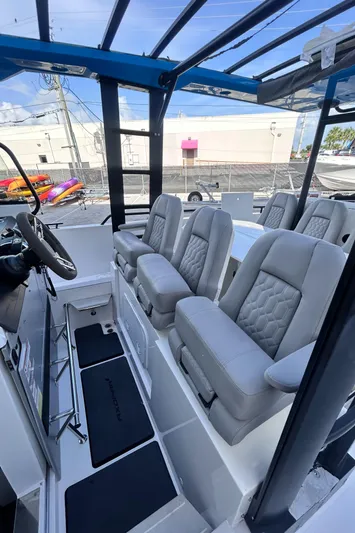  Yacht Photos Pics 2019 Axopar 37 Sun Top interior with modern seating and sleek design.