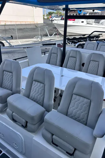  Yacht Photos Pics 2019 Axopar 37 Sun Top boat with luxurious gray seating and sleek design.