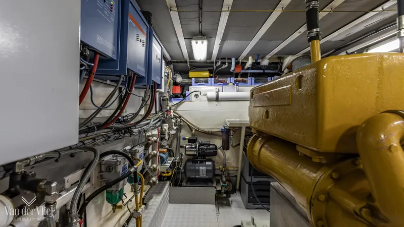  Yacht Photos Pics Engine room of a 2009 Altena Trawler, showcasing machinery and electrical systems.