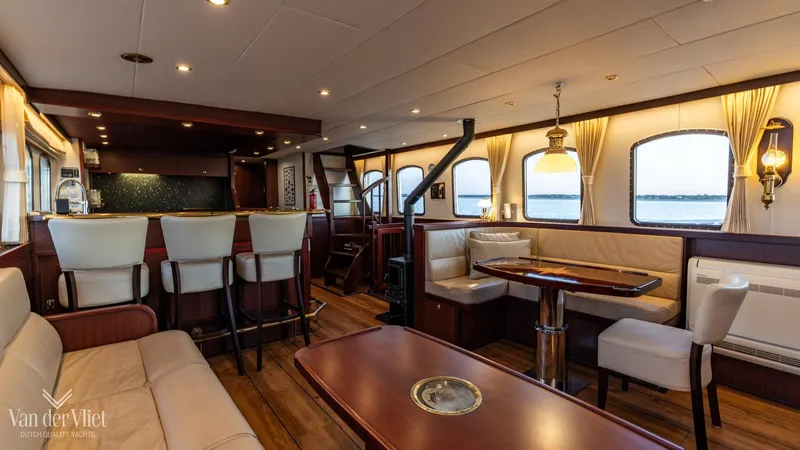  Yacht Photos Pics Luxurious interior of a 2009 Altena Trawler yacht with elegant seating and dining area.