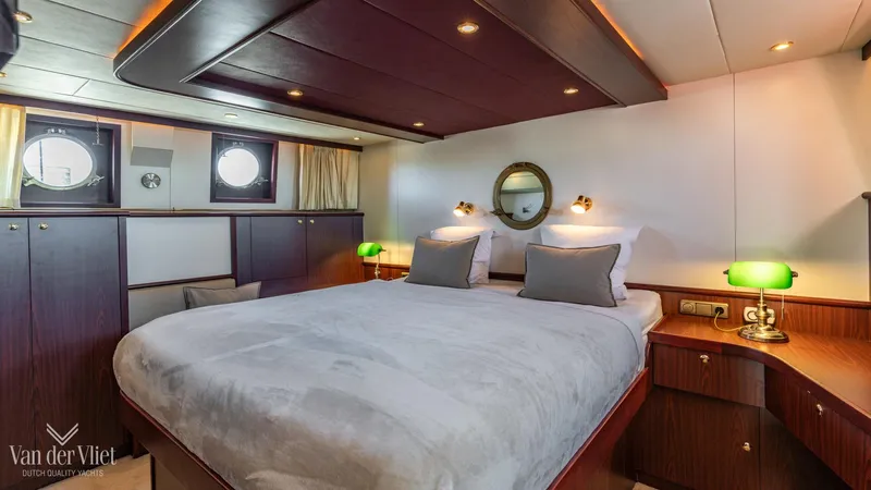  Yacht Photos Pics Luxurious cabin interior of 2009 Altena Trawler with cozy bed and elegant decor.