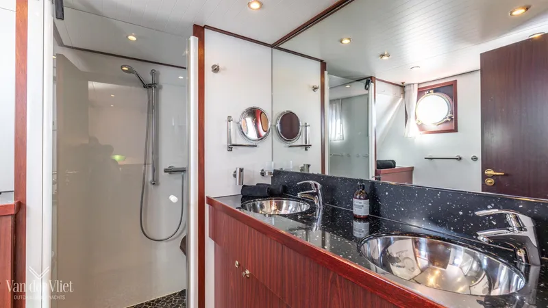  Yacht Photos Pics Luxurious bathroom in 2009 Altena Trawler with dual sinks and modern shower.