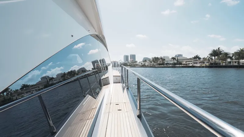 Skoupidia Yacht Photos Pics Azimut 60 Fly 2022 yacht on calm water with city view.