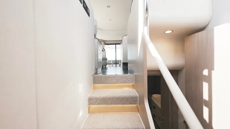 Skoupidia Yacht Photos Pics Interior of 2022 Azimut 60 Fly yacht with stairs and modern design.