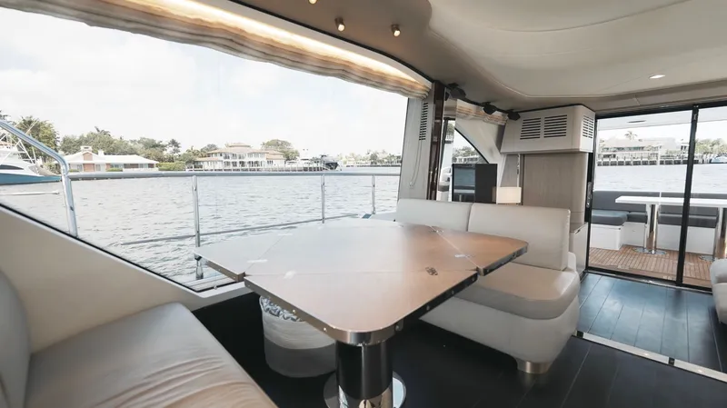 Skoupidia Yacht Photos Pics Interior of 2022 Azimut 60 Fly yacht with waterfront view.