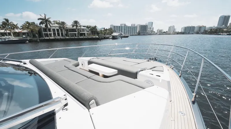 Skoupidia Yacht Photos Pics Azimut 60 Fly 2022 yacht on calm water with city view.