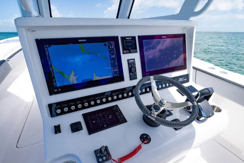  Yacht Photos Pics 2025 Streamline R 35 boat dashboard with advanced navigation screens and steering wheel.