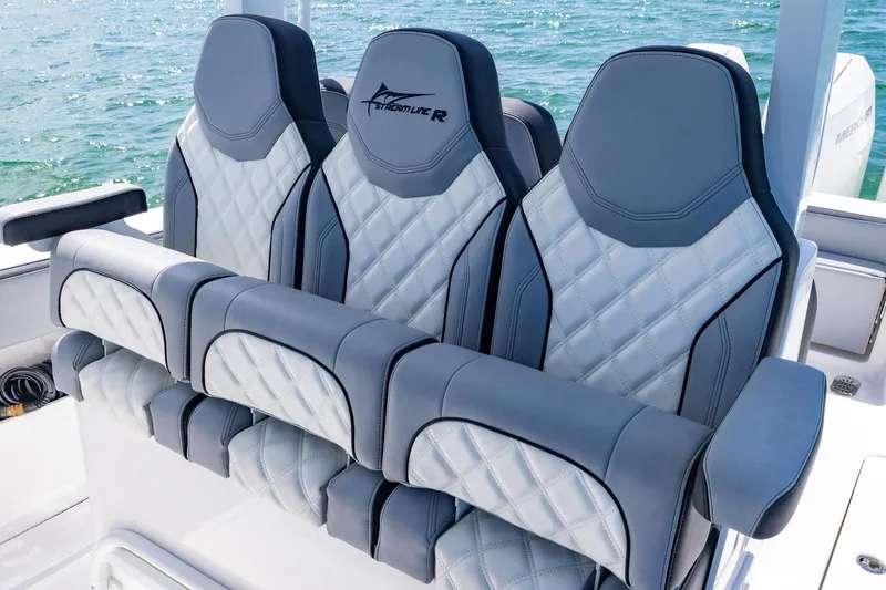  Yacht Photos Pics Luxurious seating on 2025 Streamline R 35 boat with quilted design and ocean backdrop.