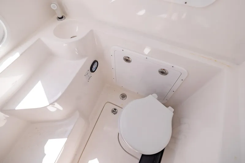  Yacht Photos Pics Compact bathroom in 2025 Streamline R 35 model with white fixtures and storage.