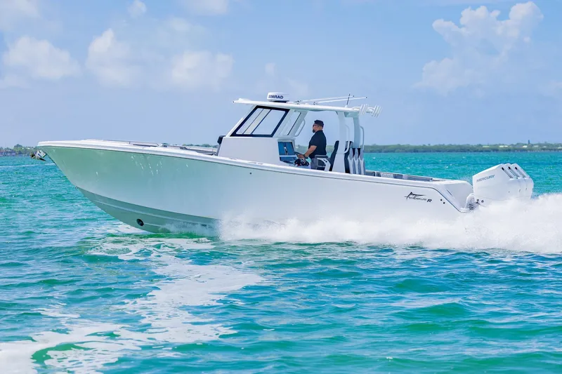  Yacht Photos Pics 2025 Streamline R 35 boat cruising on clear blue water under a sunny sky.