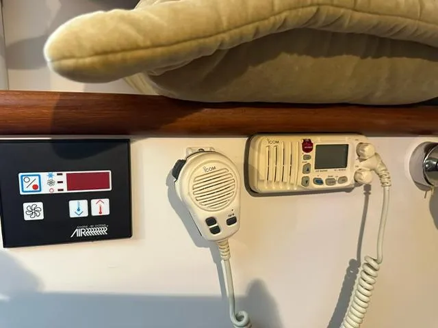  Yacht Photos Pics Control panel and radio equipment inside a 2003 Pursuit 3070 Express boat cabin.