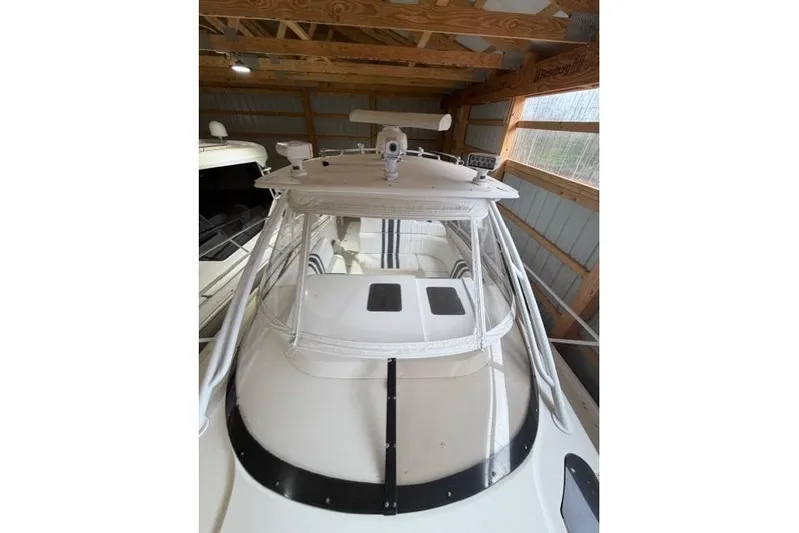  Yacht Photos Pics 2009 Intrepid 377 Walkaround boat in a wooden boathouse, top view.