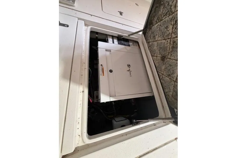  Yacht Photos Pics 2009 Intrepid 377 Walkaround engine compartment with open hatch, showcasing internal components.