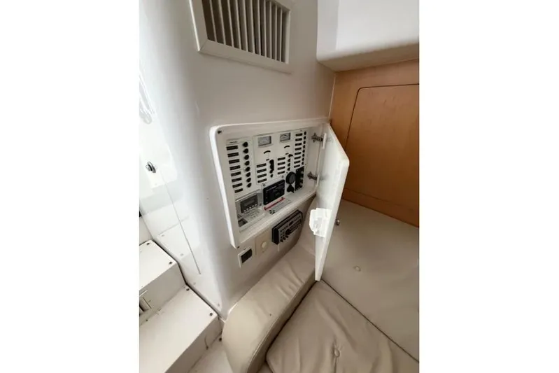  Yacht Photos Pics 2009 Intrepid 377 Walkaround interior control panel with open access door.