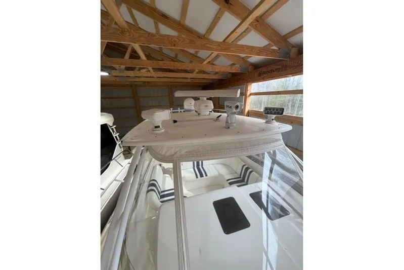  Yacht Photos Pics 2009 Intrepid 377 Walkaround boat in storage, featuring radar and navigation equipment.