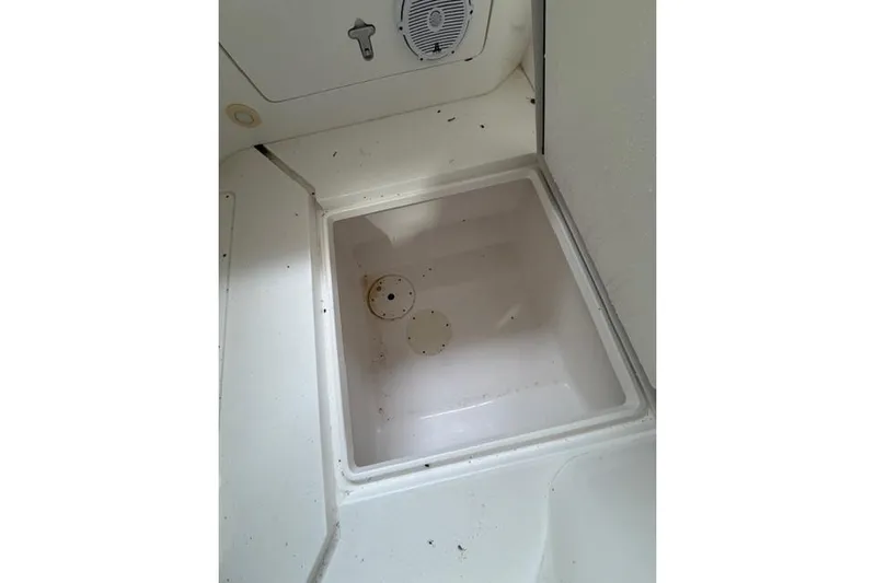  Yacht Photos Pics 2009 Intrepid 377 Walkaround boat storage compartment, white interior, open hatch.